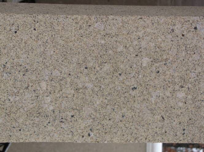 Close-up of a coarse aggregate finish above a smooth band