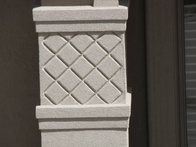 Cast lattice relief worked into a stucco column