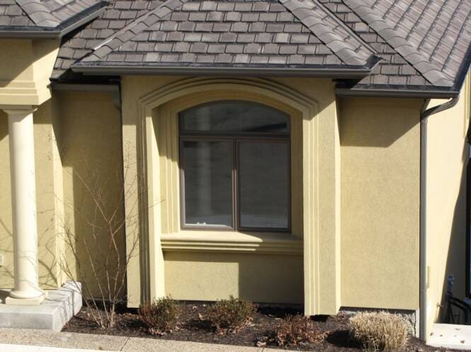 Bay window with a banded stucco surround