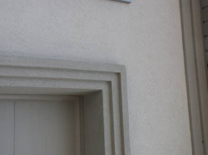 Reveal detail at a door head and jamb
