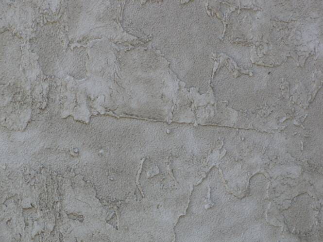 Close-up of a hand-troweled limestone-look finish in grey