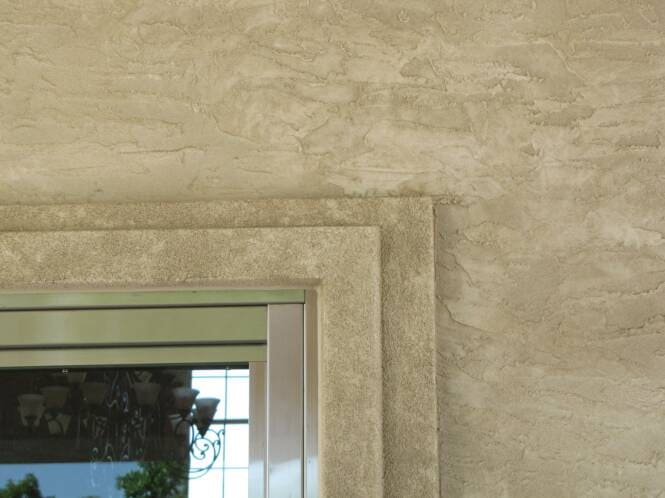 Hand-troweled limestone finish wrapping a window surround