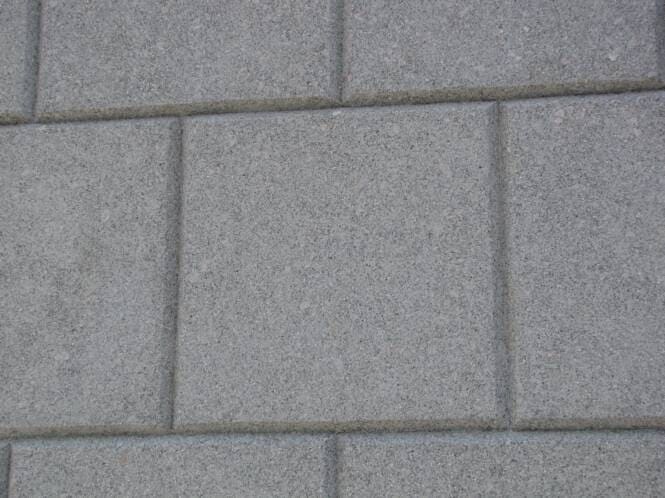 Close-up of scored stucco blocks in grey