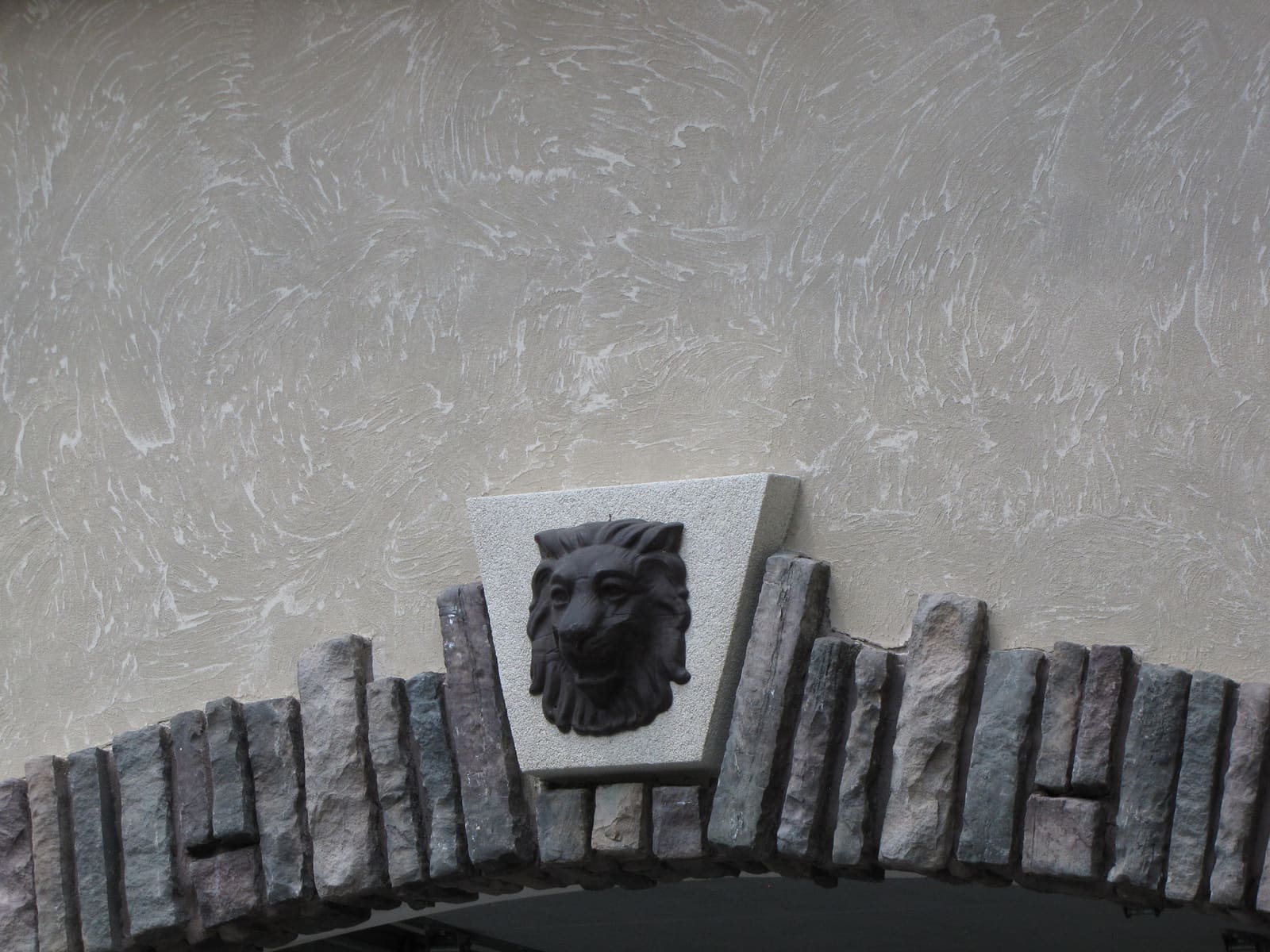 Keystone medallion set above a stone arch